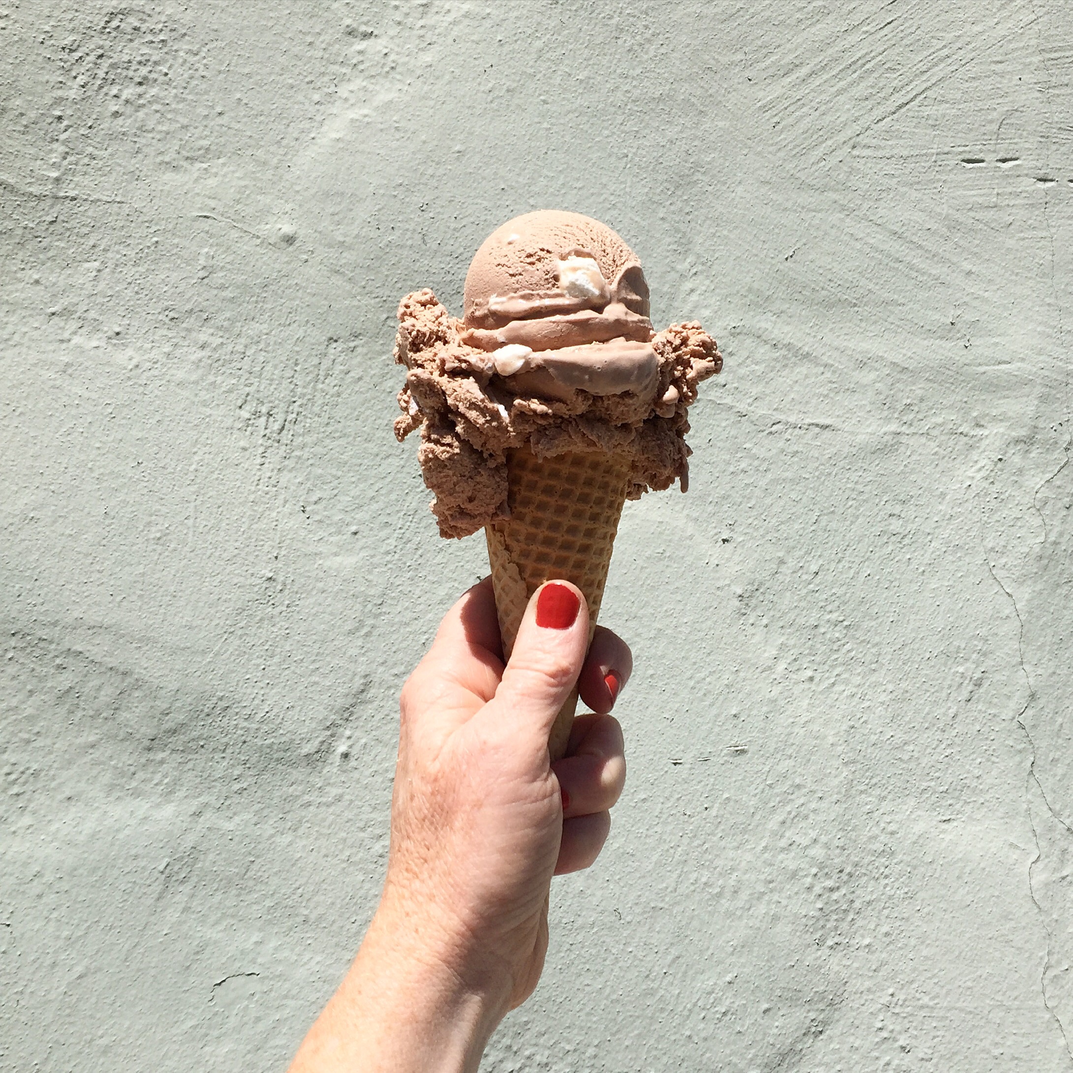 ice cream against mint wall