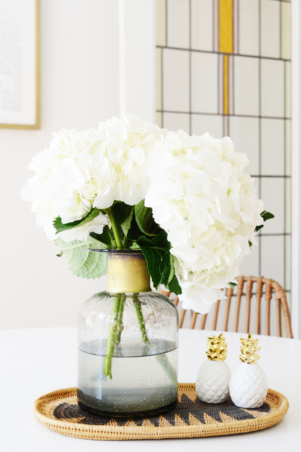 White flowers and stained glass door. 