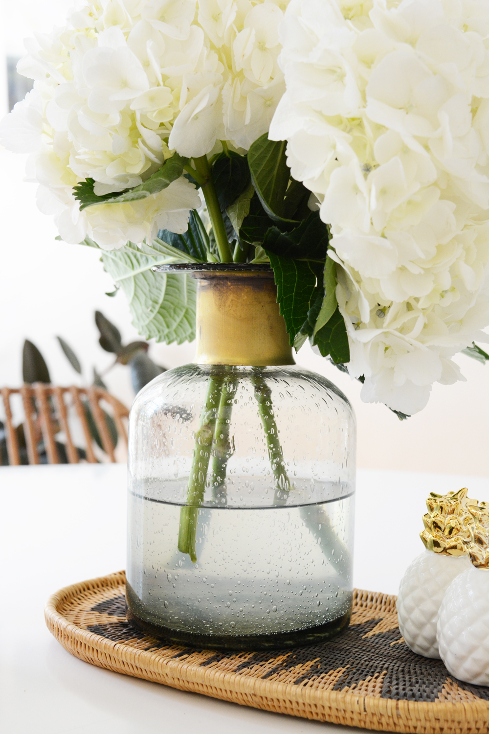 Sunroom Makeover. White hydrangea in grey and brass vase. 