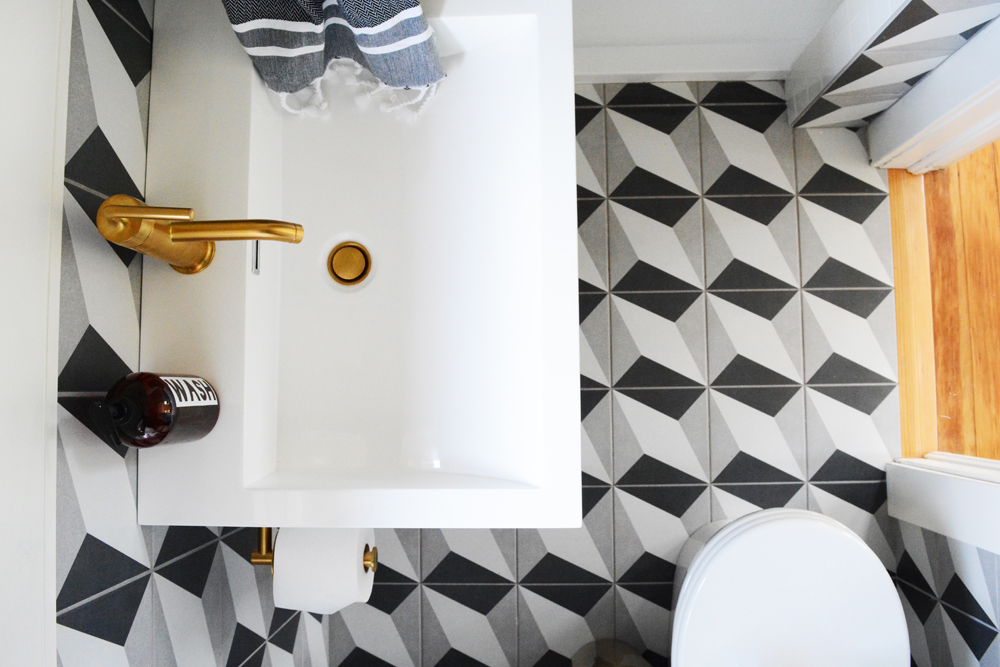 Guesthouse Bathroom Reveal - Bold patterns, crisp clean white tile, and brass fixtures. 