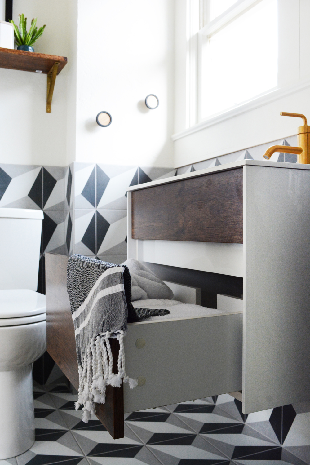 Guesthouse Bathroom Reveal - Bold patterns, crisp clean white tile, and brass fixtures. 